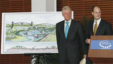 Bill Clinton and William Clark, son of William E. Clark, announce the William E. Clark Presidential Park Wetlands Project. 